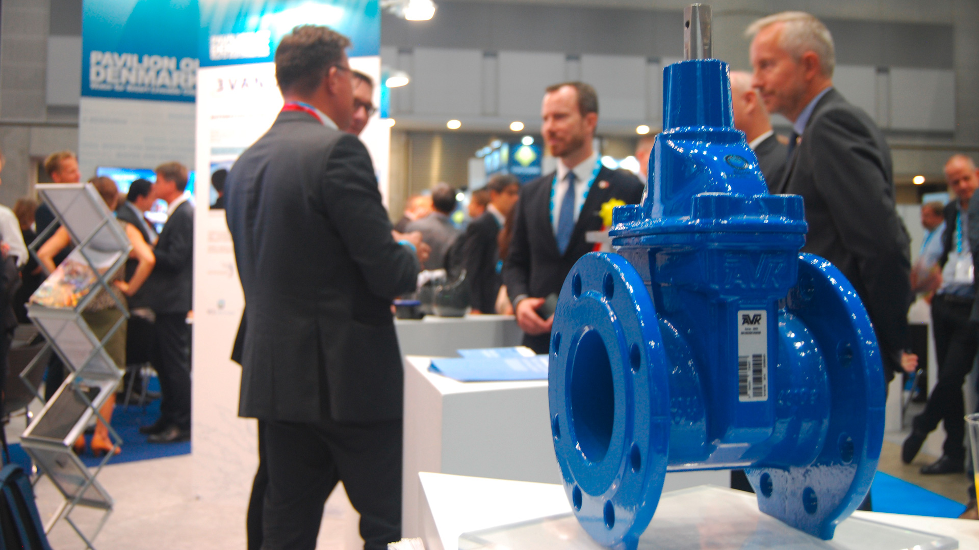 People standing at AVK booth at IWA in Tokyo