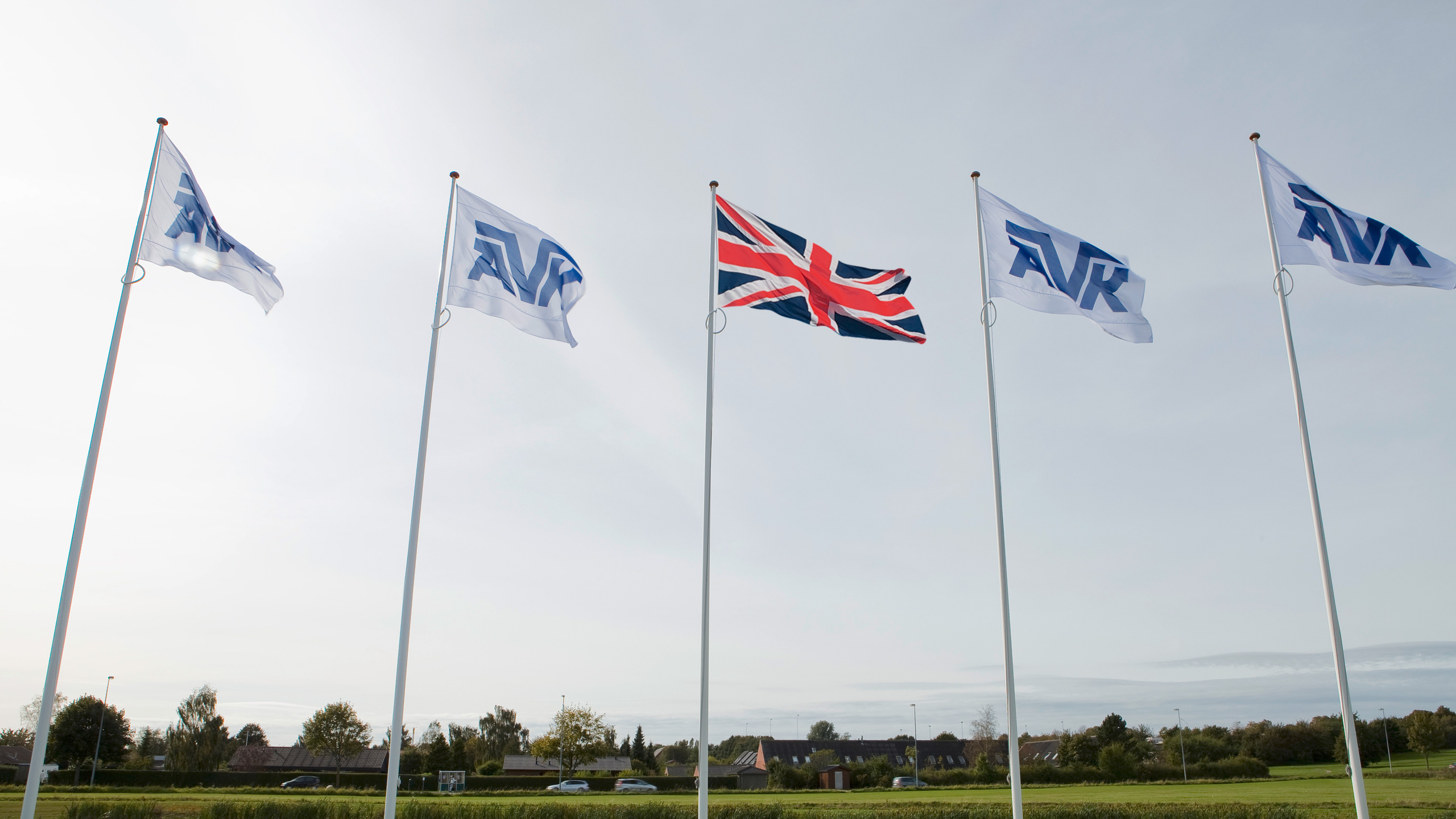AVK flags with UK flag under the sunshine